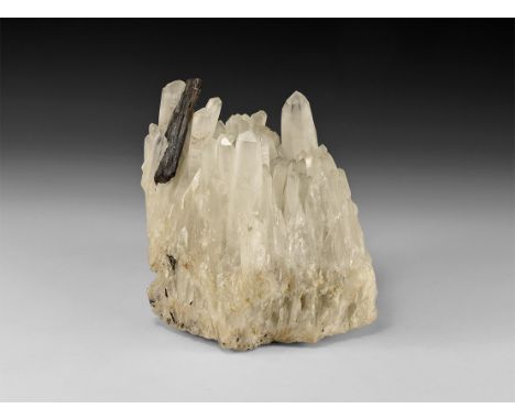 A large formation of tall white quartz crystals with a stibnite specimen.  1.83 kg, 12.5cm (5"). From a historic ‘Victorian M