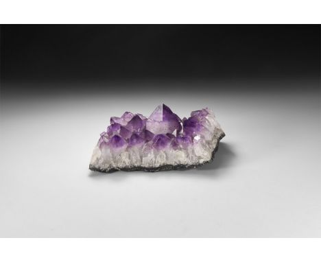 A section of large purple amethyst crystals on a matrix.  2.8 kg, 19.5cm (7 3/4"). From a historic ‘Victorian Museum’ collect