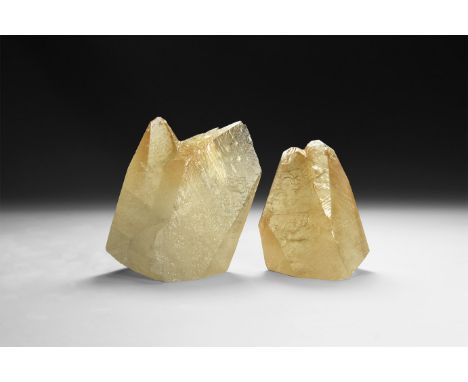 A group of two finely formed orange calcite crystals with waxy lustre.  463 grams total, 72-86mm (2 3/4 - 3 1/2"). From a his