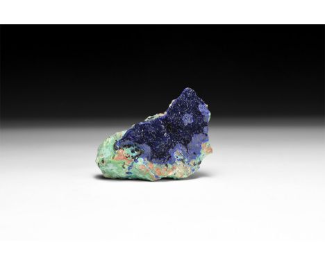 A fine specimen of deep blue azurite on matrix, in a white card box with label reading: 'Azurite, Morenci Mine, Arizona, USA'