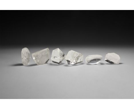 A group of six fine cut and polished quartz crystals, each in white card tray with label reading: 'Quartz (Polished) Brazil'.