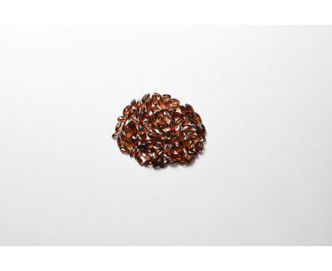 A group of one hundred marquise-cut garnets of a deep red-brown colour.  7.92 grams total, 4-8mm (39.6 carats) (1/4"). From a