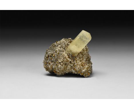 A fine specimen of a hexagonal calcite crystal on a pyrite and galena matrix, in white card tray.  39 grams, 37mm (1 1/2"). F