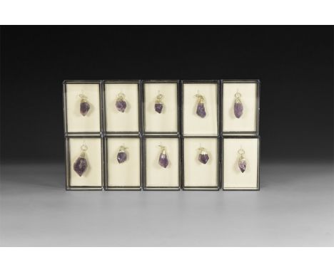 A group of ten amethyst points with electroform mounts and suspension rings; each in a perspex display box.  158 grams total,