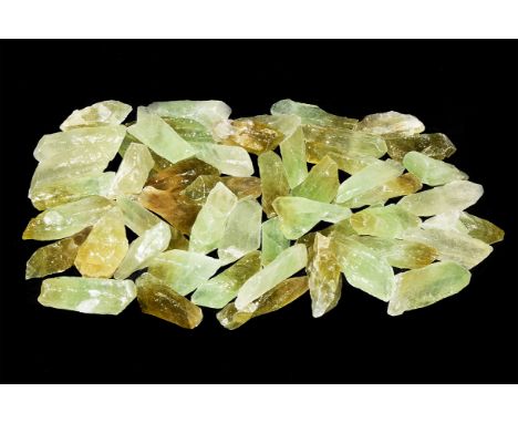 A group of fifty calcite chunks with pale green colour.  725 grams, 30-50mm (1 1/4 - 2"). From a historic ‘Victorian Museum’ 