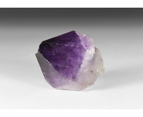 A large amethyst crystal specimen, from Rio Grande do Sul, Brazil, in white card tray with identification label.  1 kg, 30-54