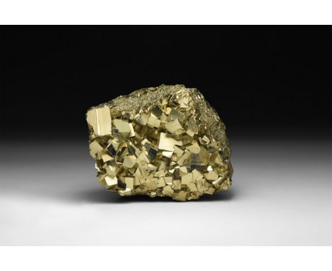 A fine specimen of a pyrite (Fool's gold) with a formation of larger cubic crystals to one side, in white card tray with a la