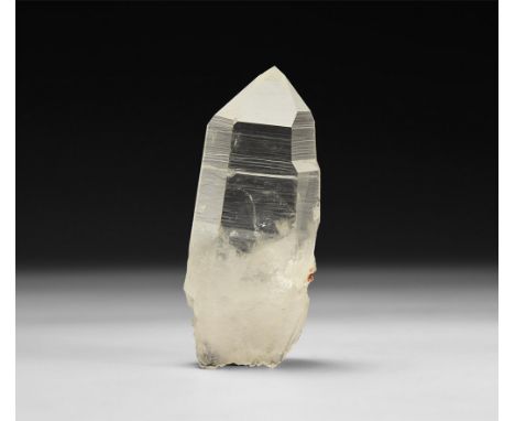 A hexagonal-section quartz crystal in collector's card tray with label reading 'Quartz Crystal / Hot Springs / Arkansas / U.S