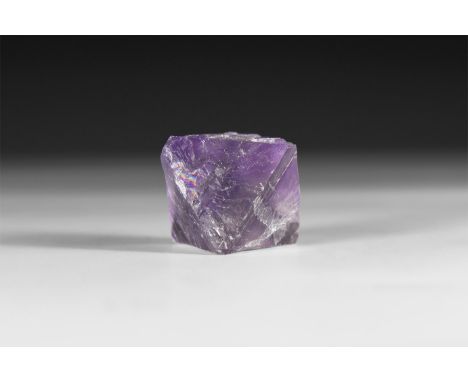 A fine specimen of pale purple octahedron fluorite crystal, in white card tray with label reading: 'Fluorite, Illinois, U.S.A
