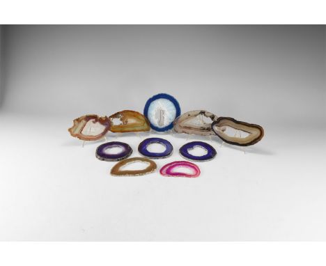A group of ten cut and polished banded agate slices, including brown, pink and blue colour bands; some colour enhanced.  431 