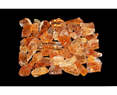 A group of fifty irregular yellow calcite mineral specimens.  528 grams total, 29-37mm (1 1/4 - 1 1/2"). From a historic ‘Vic