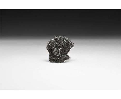 A piece of specularite (specular hematite) in white card tray with label reading: 'SPECULARITE, Florence Mine, Cumbria'.  54 