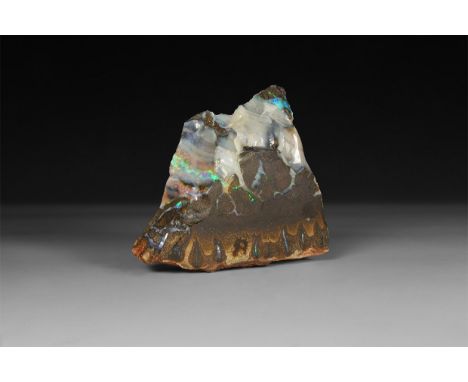 A particularly fine example of precious opal in matrix from Australia, with numerous opal veins, all showing good 'fire', wit