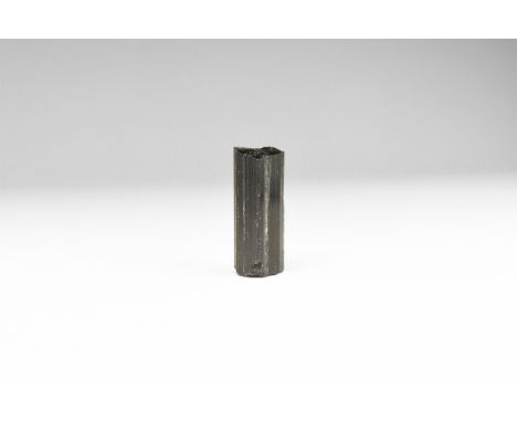 A fine black tourmaline column, in white card tray with label reading: 'TOURMALINE, Minas Gerais, Brazil'.  16 grams (80 cara
