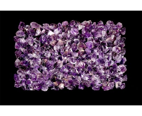 A group of two hundred and fifty purple amethyst crystal specimens.  1.7 kg total, 17-40mm (1/2 - 1 1/2"). From a historic ‘V