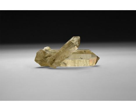 A fine specimen of anatase crystals developed on the outside of two joined smoky quartz crystals, in white card tray.  33 gra