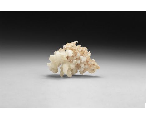 A fine specimen of a calcite forming numerous spherical aggregates, on a pale pin matrix.  129 grams, 93mm (3 1/2"). From a h