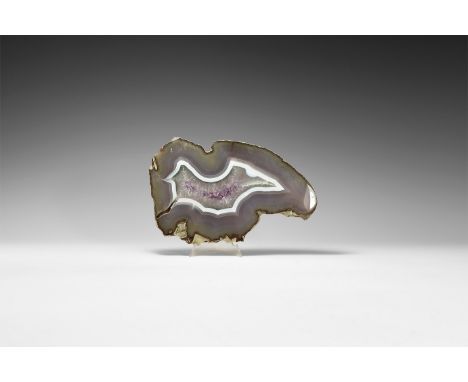A finely cut slice of purple and white banded agate, with lilac and white amethyst crystals to the centre.  612 grams, 19cm (