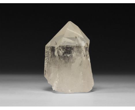 A fine specimen of transparent quartz crystal with rainbow reflections.  551 grams, 97mm (3 3/4"). From a historic ‘Victorian