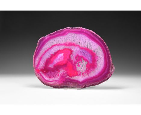 A fine cut and polished agate slice with pink and white bands, honeycomb crystal formation, colour enhanced.  735 grams, 26cm