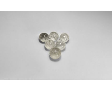 A group of six rock crystal specimens each presented as a polished sphere, in a card tray.  488 grams total, 34-40mm (1 1/4 -