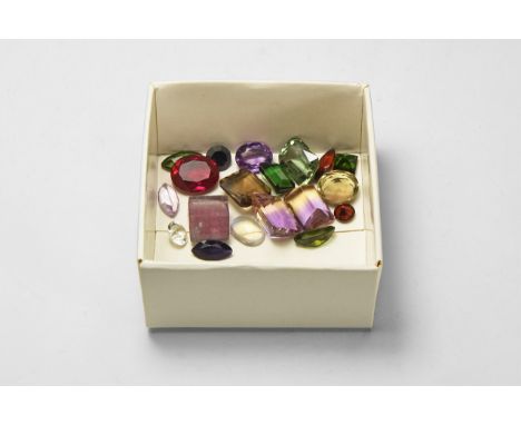 A group of nineteen finely cut and polished gemstones, including amethyst, quartz, garnet, fluorite and green tourmaline; in 