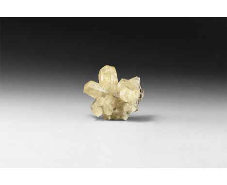 A fine specimen of a yellow calcite crystal formation , in white card tray with label reading: 'Calcite, Tri-State (Miller Co