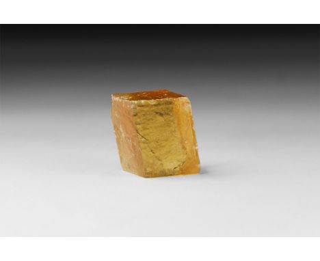 A fine specimen of a finely cut block of orange calcite, in white card tray with label reading: 'Calcite, Mexico'.  20 grams,