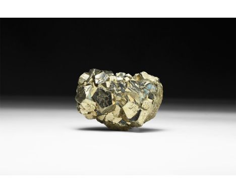 A fine pyrite (Fool's Gold) mineral specimen with lustrous surface, in white card tray with label reading: 'Pyrite, Huanaco, 