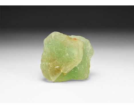 A fine specimen of a semi-transparent pale green etched octahedron of fluorite, in white card tray.  116 grams, 50mm (2"). Fr