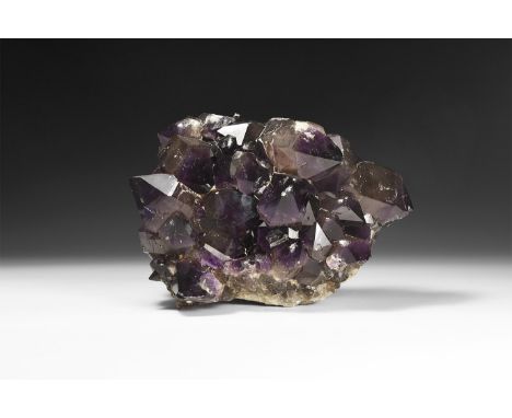 A cluster of large and dark amethyst crystals.  4.13kg, 21cm (8 1/4"). From a historic ‘Victorian Museum’ collection; from th