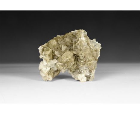 A fine specimen of pale brown siderite 'blades' on white quartz with small specimens of cubanite, in white card tray with old
