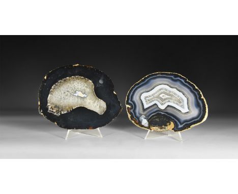 A group of two cut and polished agate slices, with bands of white and blue agate and honeycomb crystals.  307 grams total, 13