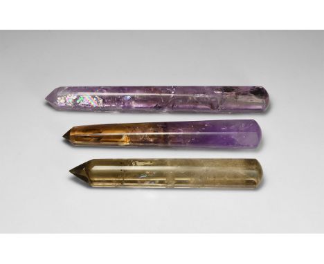 A group of three polished amethyst, ametrine, and smokey quartz obelisks, or massage tools.  120 grams total, 9.5-10.5cm; 600
