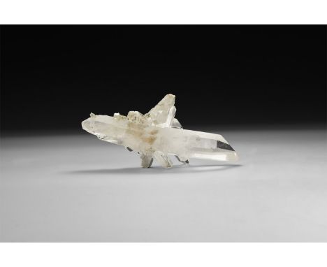An exceptional formation of transparent quartz crystals, in white card box with label reading: 'Quartz, Corinto, Minas Gerais