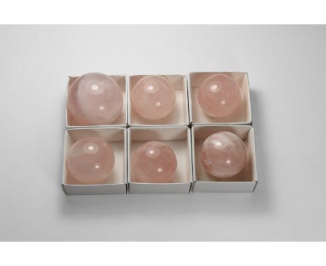 A group of six rose quartz polished spheres, each in a card tray.  655 grams total, 38-49mm (1 1/2 - 2"). From a historic ‘Vi