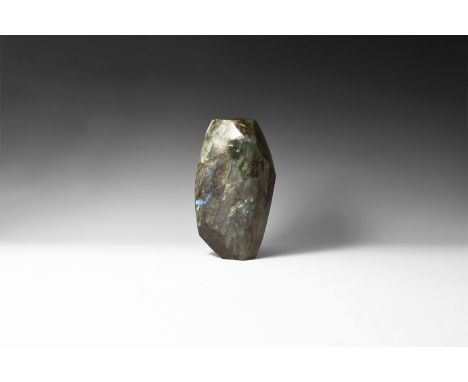 A large polished labradorite boulder with rich colour play on front face, principally blue, green and gold; from Madagascar. 