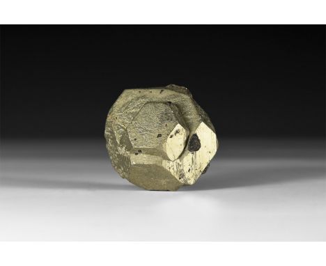 A fine specimen of unusually formed dark pyrite (Fool's Gold) crystal, in white card tray with label reading: 'Pyrite, Huanac