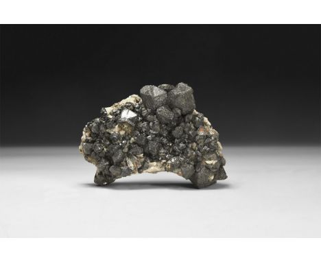 A fine specimen of sphalerite crystals on a matrix, in white card tray and an old hand-written label reading 'Sphalerite, Cor