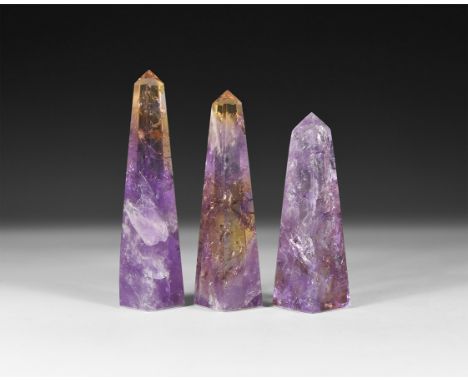 A group of three cut and polished amethyst obelisks.  145 grams total, 70-85mm (2 3/4 - 3 1/4"). From a historic ‘Victorian M
