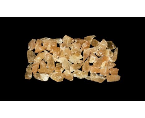 A group of fifty orange calcite chunks with waxy lustre.  460 grams total, 25-65mm (1 - 2 1/2"). From a historic ‘Victorian M