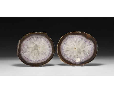 A pair of thick cut and polished amethyst nodule slices with white rainbow-reflection quartz crystals.  939 grams total, 13.3