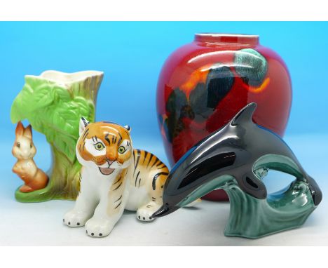 A Poole Pottery Odyssey vase, a Poole dolphin, a Russian tiger figure and a Withernsea vase