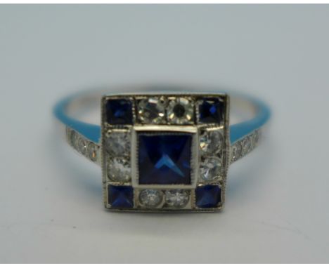 An Art Deco 18ct white gold, sapphire and fourteen stone diamond dress ring, 3g, N½