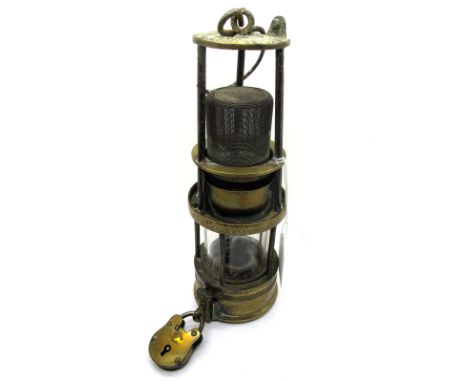 A Richard Johnson Clapham &amp; Morris of Manchester Type 4 Deflector Miner's Safety Lamp, with padlock, 32cm high (including