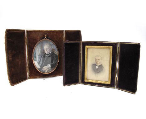 An Early XX Century Portrait Miniature Painted on Paper, of an elderly gentleman seated reading a book, 10cm long, in a yello