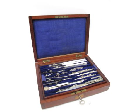 An Early XX Century Mahogany Cased Geometry Set, with lift-out tray containing eighteen various instruments, the lid with vac