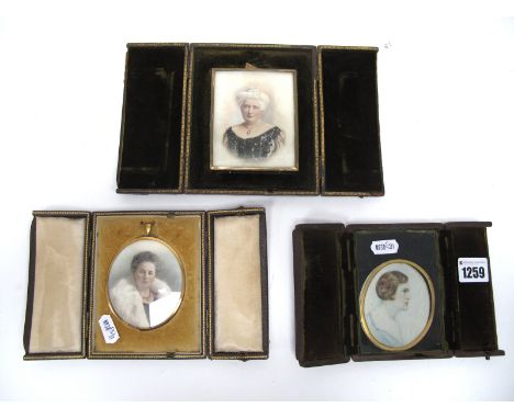 An Early XX Century Portrait Miniature Painted on Ivory, and signed T.O.D. Williams, of a lady wearing a blue dress and pearl