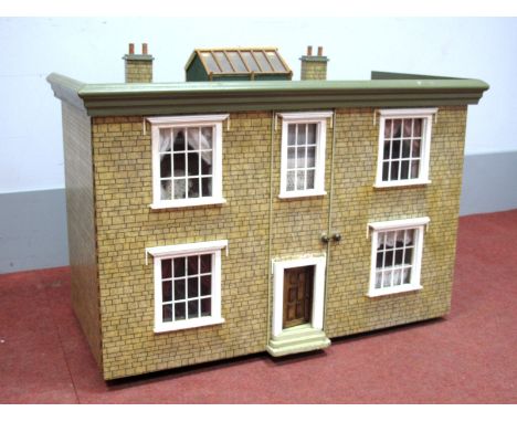 A XX Century Dolls House, two storey with sash windows, moulded cornice, with a large and full dressed interior and accessori