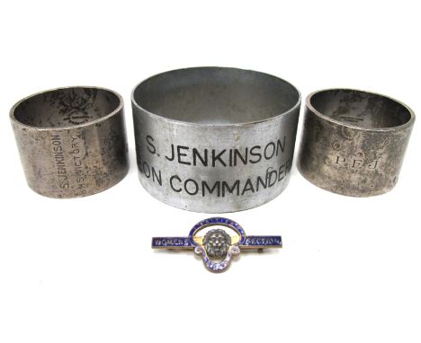 A Silver Napkin Ring, stamped "S. Jenkinson, HMS Victory"; Another, initialled "P.E.J."; plus a larger base metal ring, stamp